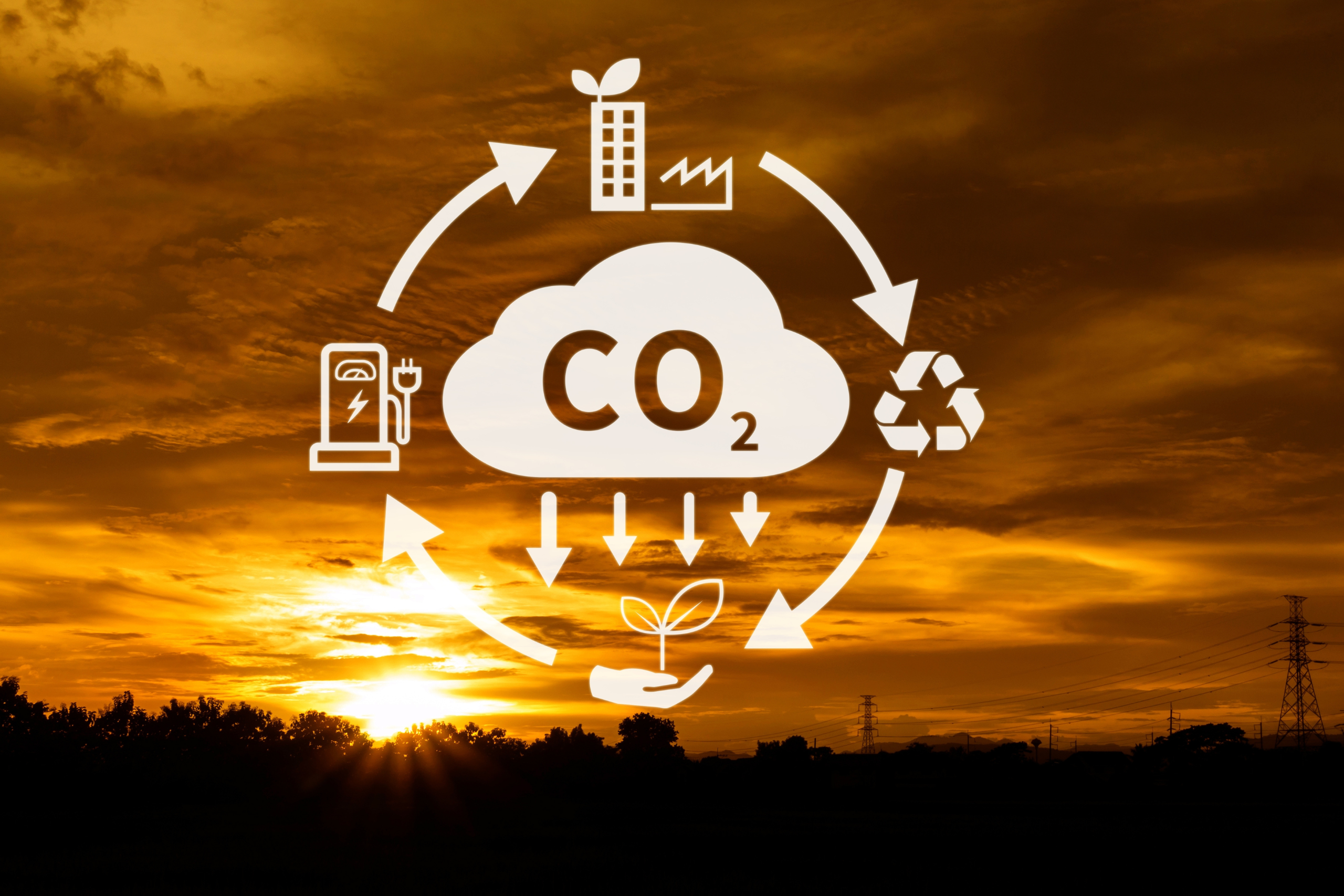 Carbon Capture symbol with a sunset in the background